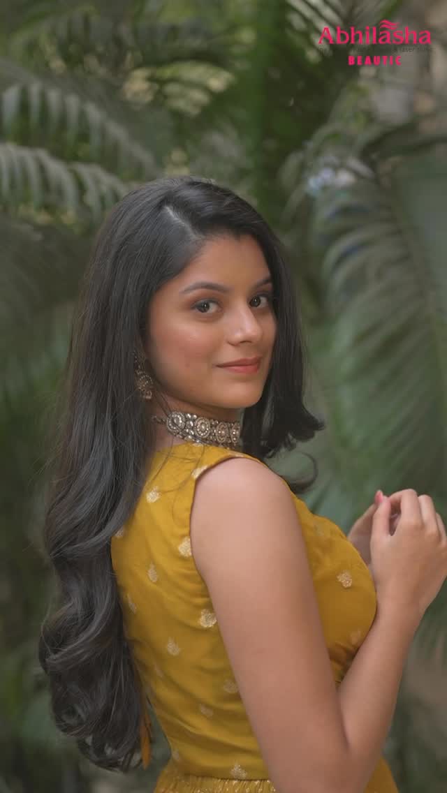 Client with flowing styled hair and occasion makeup by Abhilasha Beautic