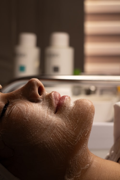 Cleansing foam applied during a facial