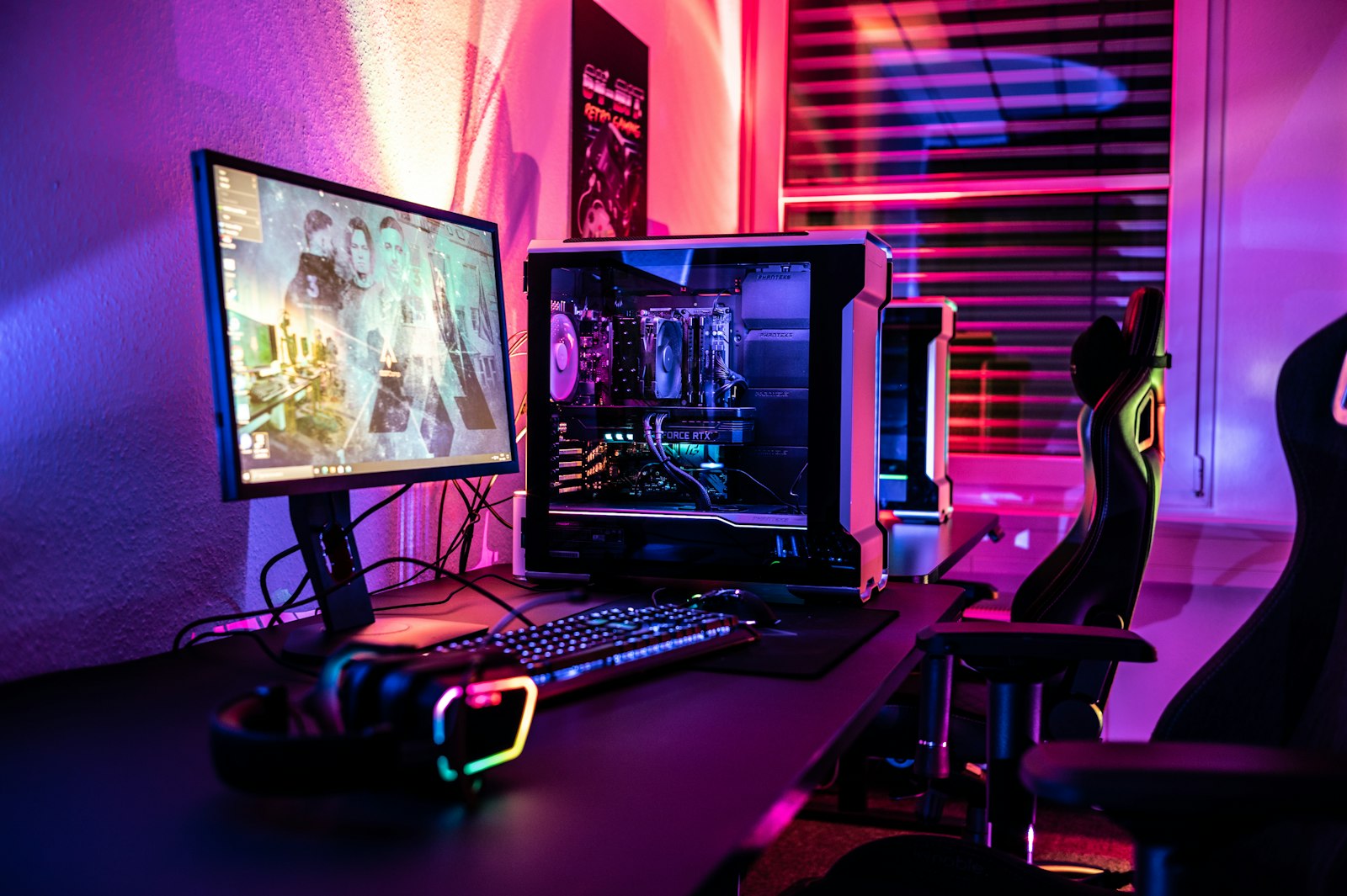 Full gaming room with RGB PC, gaming chair and neon lighting