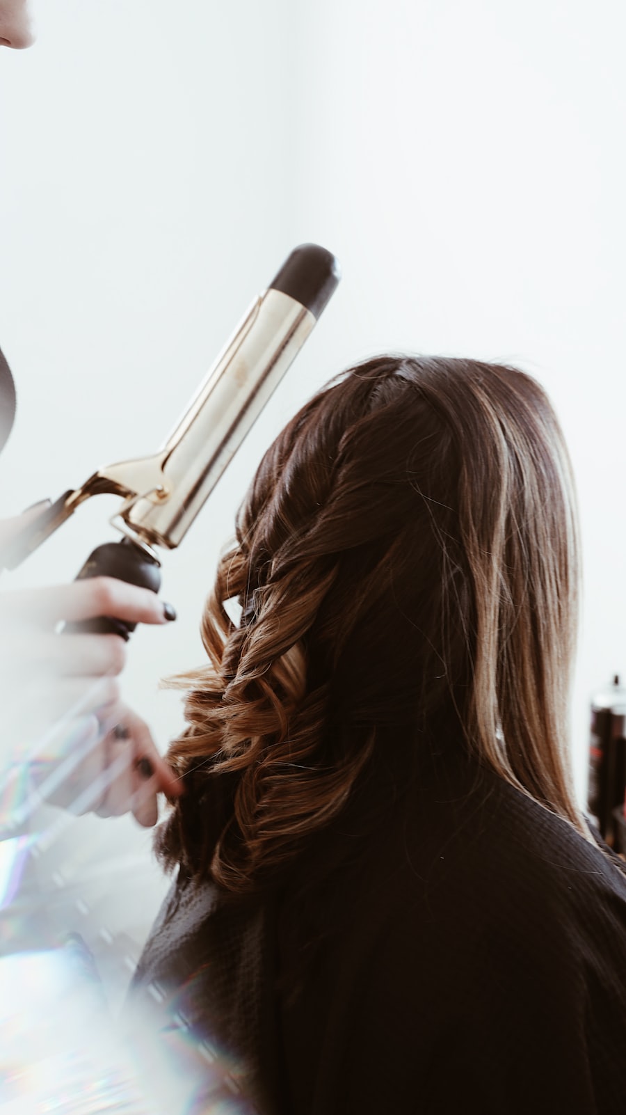 Balayage at Astha Salon, Ahmedabad — hand-painted caramel, grown out through the mid-lengths