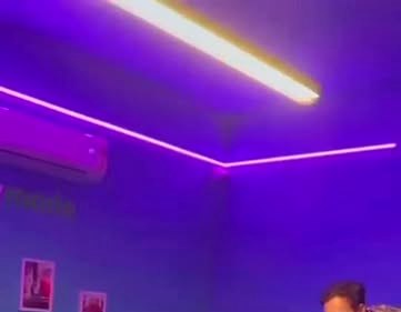 Purple and amber neon glow across the playmode ceiling