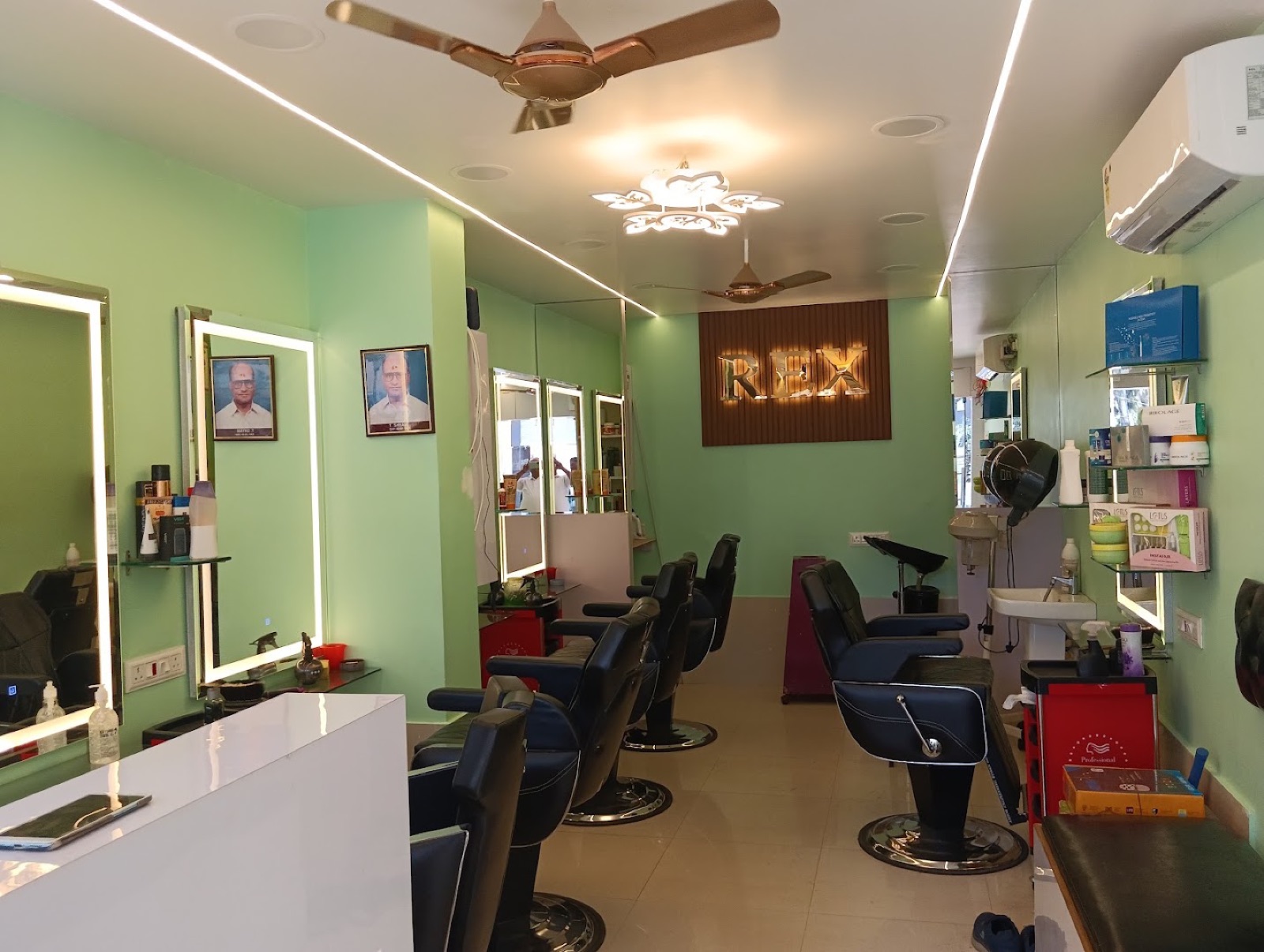 The renovated side of the hall — halo-lit mirrors down a green wall