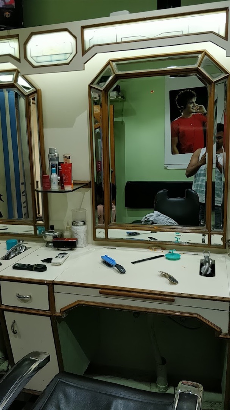A vintage wood-framed mirror station, kept exactly as it was