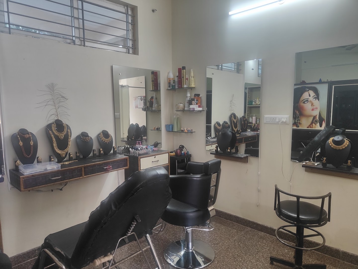 Gold bridal necklace sets on black display busts at Siri Spa and Salon, Nagarbhavi
