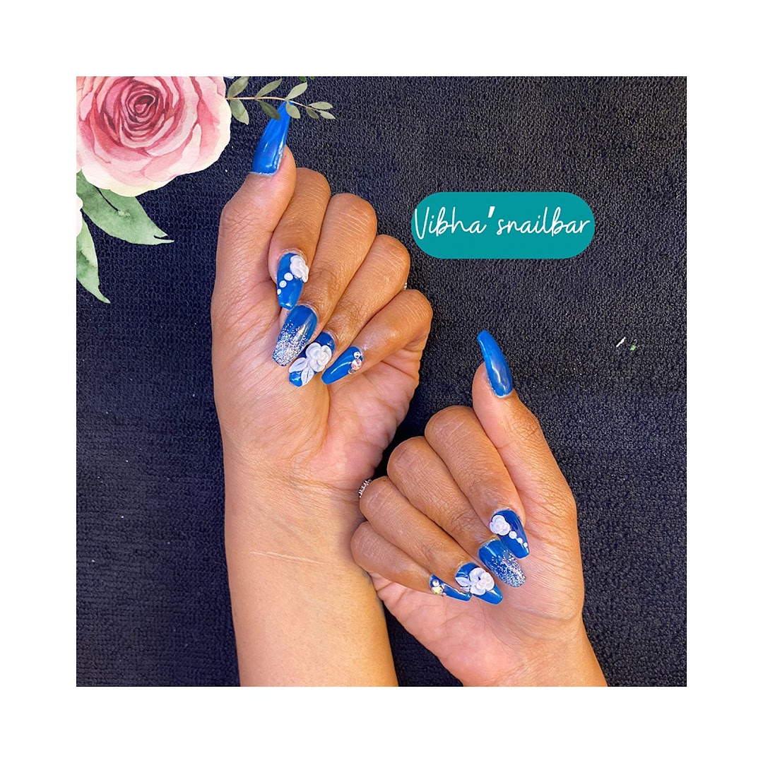 Blue-and-white nail art extensions from Vibha's nail bar at STUDIO@11.