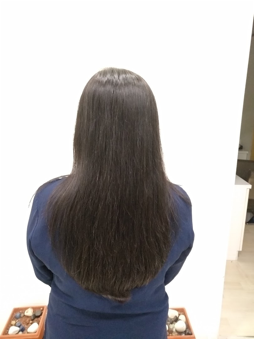 Silk-straight finish on waist-length hair at STUDIO@11.